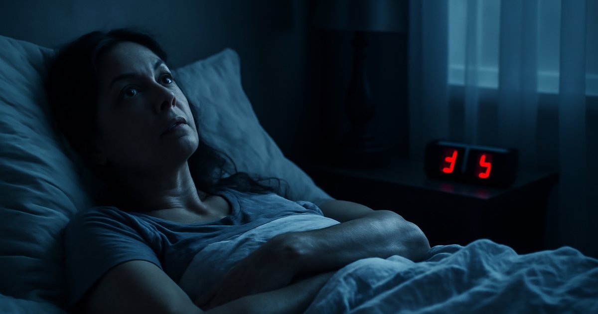 Woman lying awake at night with anxious expression, unable to sleep due to anxiety
